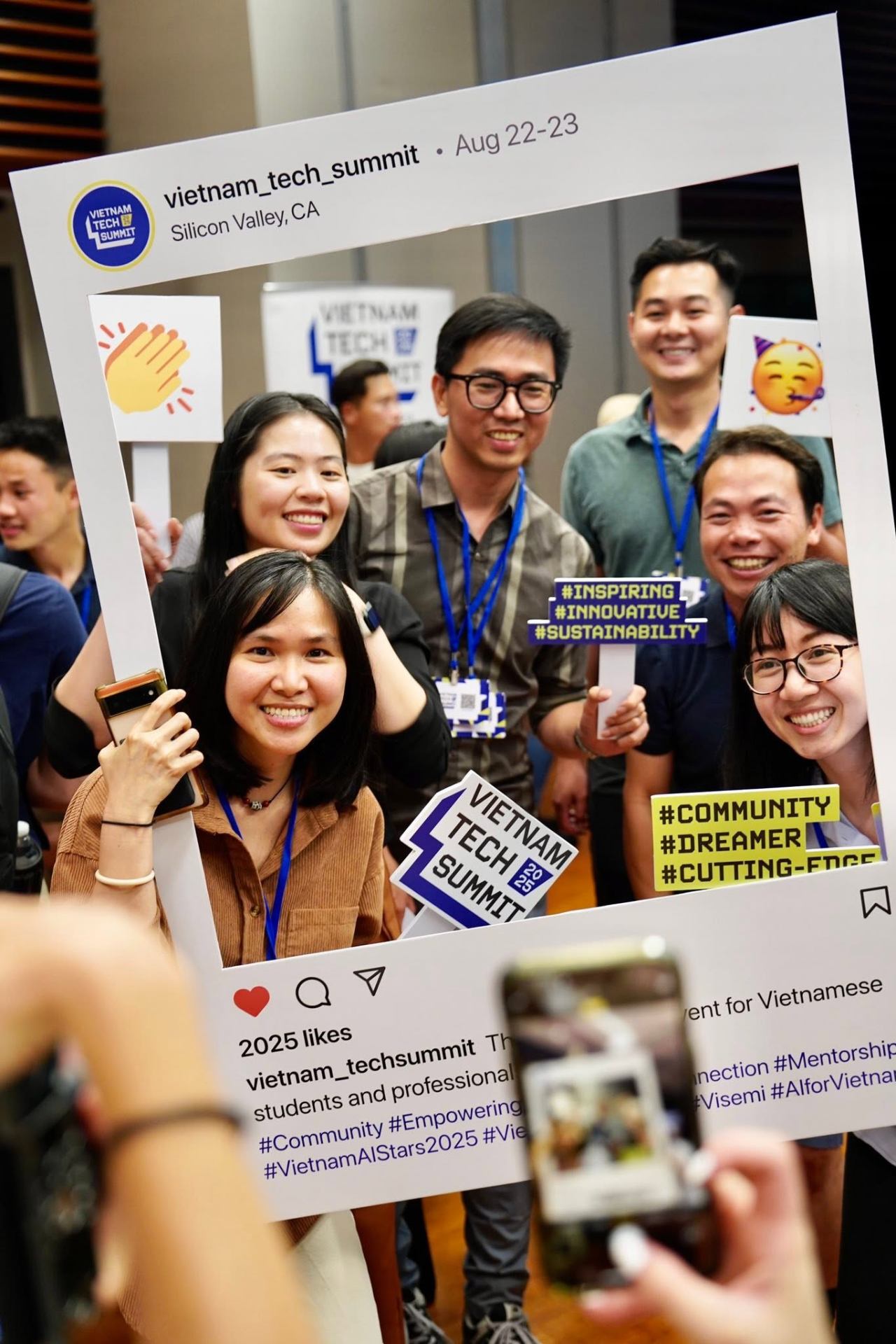 Young attendees gathered together holding the summit frame